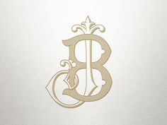 the letter b is made up of gold foil and has an ornate design on it