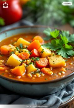 a close up of a bowl of soup with carrots and corn on the side