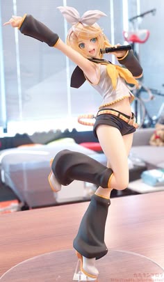 a figurine is posed on top of a table