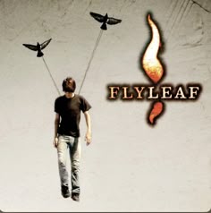 a man is walking with two birds on his head and the word flyleaf above him