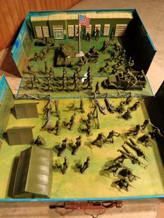 a box filled with lots of toy army figures