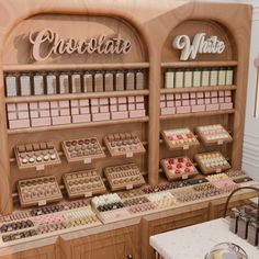 there are many different types of chocolates on display in the store, and one is for sale