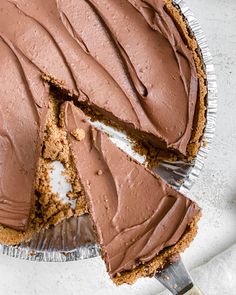 a chocolate pie with one slice missing from it