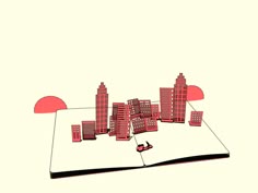 an open book with red buildings on it