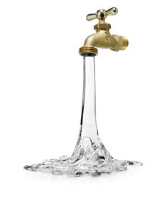 a glass water faucet with a golden faucet on the top and bottom