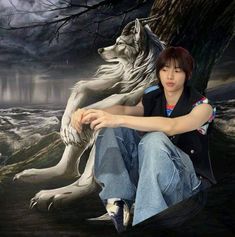 a woman sitting on the ground next to a white wolf in front of a painting