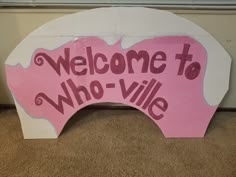 a sign that says welcome to who - vile