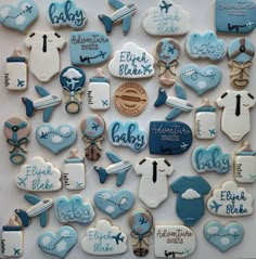 baby shower cookies are arranged in the shape of an airplane and its name on them