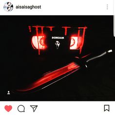 a black and white photo with red lights in the dark next to a hair dryer