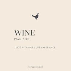 a bird sitting on top of a piece of paper next to a bottle of wine