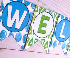 two blue and green banners with the letters e, f, and w on them