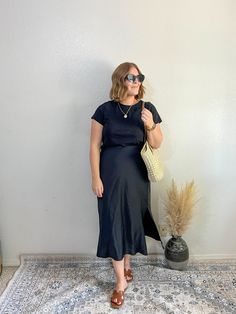 elevated style, elevated casual, midi slip skirt, how to style a skirt, neutral outfits, summer outfit inspo, effortless style Satin Midi Skirt Outfits Summer, Silk Black Skirt Outfit, Black Silk Midi Skirt Outfit Summer, Black Silk Skirt Outfit Summer, Black Satin Midi Skirt Outfit, Silk Skirt Outfit Summer, Spring Black Satin Skirt, Summer Black Relaxed Skirt, Black Slip Skirt Outfit