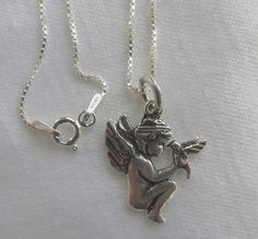 Cherub Necklace, #Angel with Bird, Sterling Silver 12" Chain, Guardian Angel, Child's Necklace, Little Girls Jewelry  This is the sweetest sterling silver necklace with Cher... #vintage #jewelry #antiques #fashion #home #garden #follow #vintagevoguetreasure #communion #angel ➡️ http://etsy.me/2qA7Yoi Cherub Jewelry Design, Cherub Themed Jewelry, Cherub Pendant, Cherub Necklace, Baby Angel Necklace, Gold Cherub Necklace, Coro Cherub Jewelry, Vintage Cherub Necklace On Chain, Vintage Angel Charm Bracelet