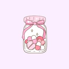 a jar filled with candy on top of a pink background