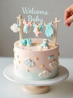 a baby shower cake with blue and pink decorations