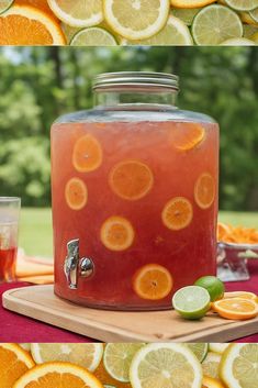 there are oranges and limes on the table next to a beverage dispenser