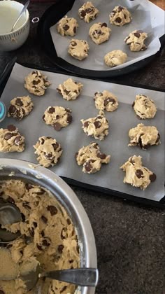 chocolate chip cookies are being made on a cookie sheet and ready to go into the oven