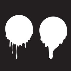 two pieces of white icing on a black background, one melting and the other drizzled