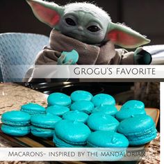 the baby yoda is sitting next to some blue macarons