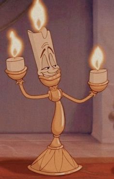a cartoon character holding two candles in each hand