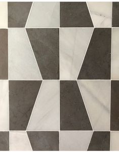 a white and grey tiled floor with different shapes
