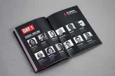 an open book with black and white photos on the front cover, which reads day 1