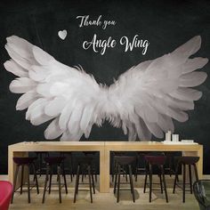 an angel wing wall decal with the words thank you, angel wing on it