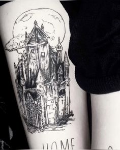 two people with tattoos on their legs, one has a castle and the other has a moon