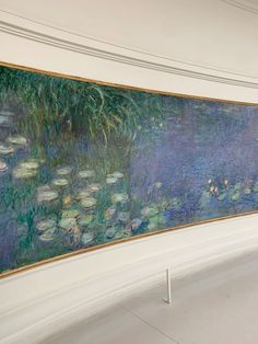 a large painting hanging on the side of a wall