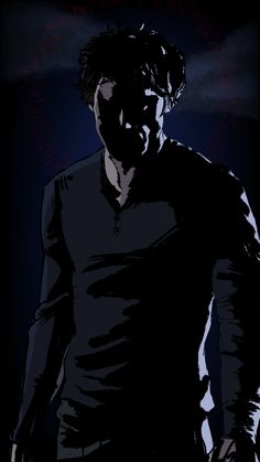 a man standing in the dark with his hand on his hip and looking at something