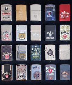 a collection of lighters sitting on top of a black table next to each other