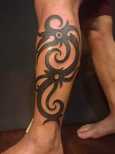 a man with a tattoo on his leg