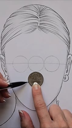 a drawing of a man's face with a coin in front of it and a hand holding a pen