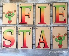 four wooden signs with the words fiesta and cactus on them