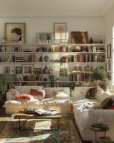 a living room filled with lots of furniture and bookshelves covered in pictures on the wall