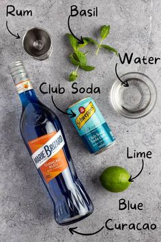 the ingredients to make an alcoholic cocktail including limes, water and vodka are shown