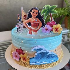 a cake decorated to look like moan from the little mermaid