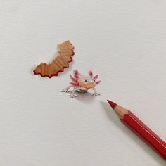 a pencil and paper cut out to look like an animal with wings on its back