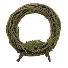 a moss covered wreath with twig handles