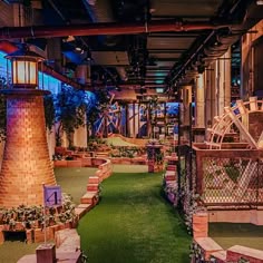 an indoor miniature golf course with artificial turf