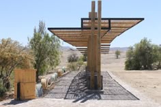 a wooden structure sitting in the middle of a desert