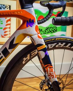 a close up of a bike on a wooden floor
