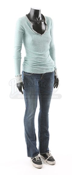 a mannequin wearing jeans and a sweater