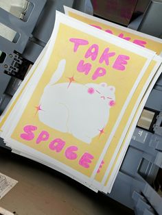 there is a sign that says take up space on the side of a printer machine