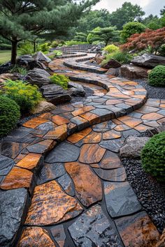 a stone path surrounded by trees and bushes