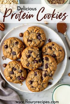 chocolate chip cookies on a white plate with milk and nuts in the background text reads delicious protein cookies