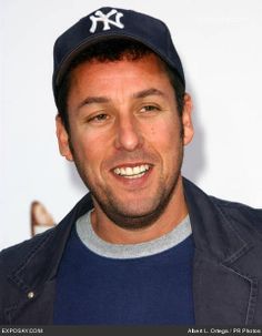 a man wearing a baseball cap and smiling
