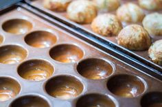 two trays filled with different types of pastries