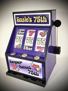 a purple and black slot machine sitting on top of a table