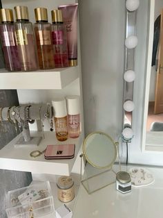 there is a vanity with many different items on it